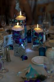 3. Floating Candles & Feathers Centerpiece