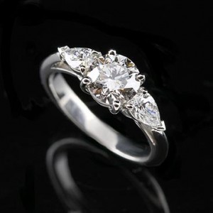 4. Pear Shaped Ring with Side Stones